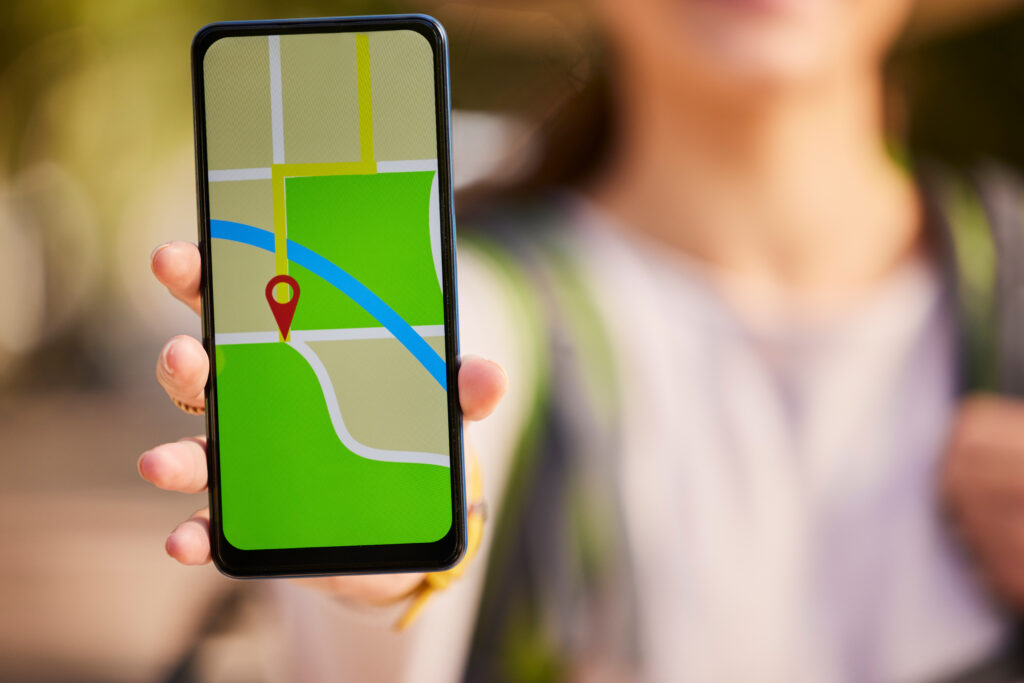 Woman hand, phone screen or gps transport app, travel or delivery for direction of road, streets an.